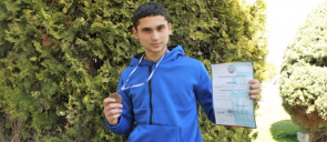 kid in blue wearing Bronze medal in the Panhellenic Tae Kwon Do championship