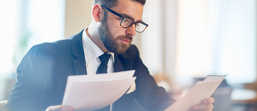 A Man Reading Documents